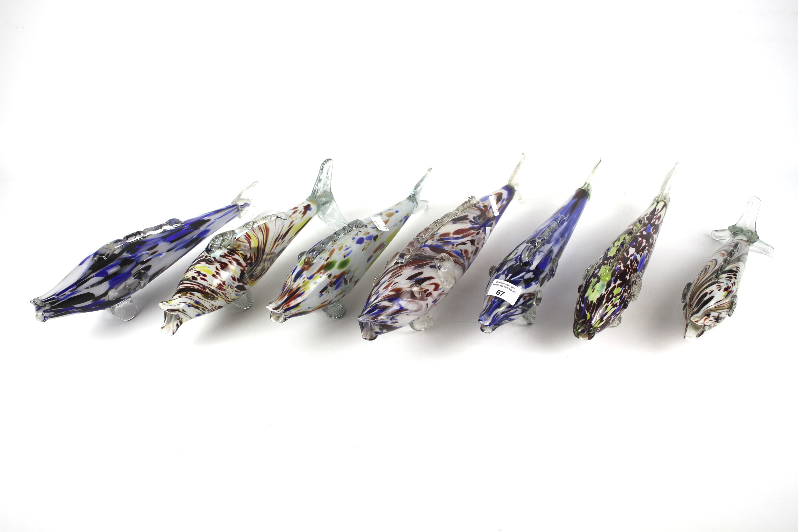 A collection of retro Murano glass fish, of varying sizes.