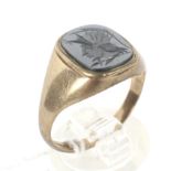 A 9ct gold signet ring. Set with a carved black onyx, weight 3.