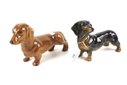 A Beswick pottery model of a pale brown dachshund and another model similar.
