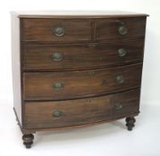 A 19th century bow fronted chest of drawers.