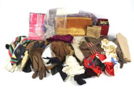 An assortment of scarves and leather gloves.