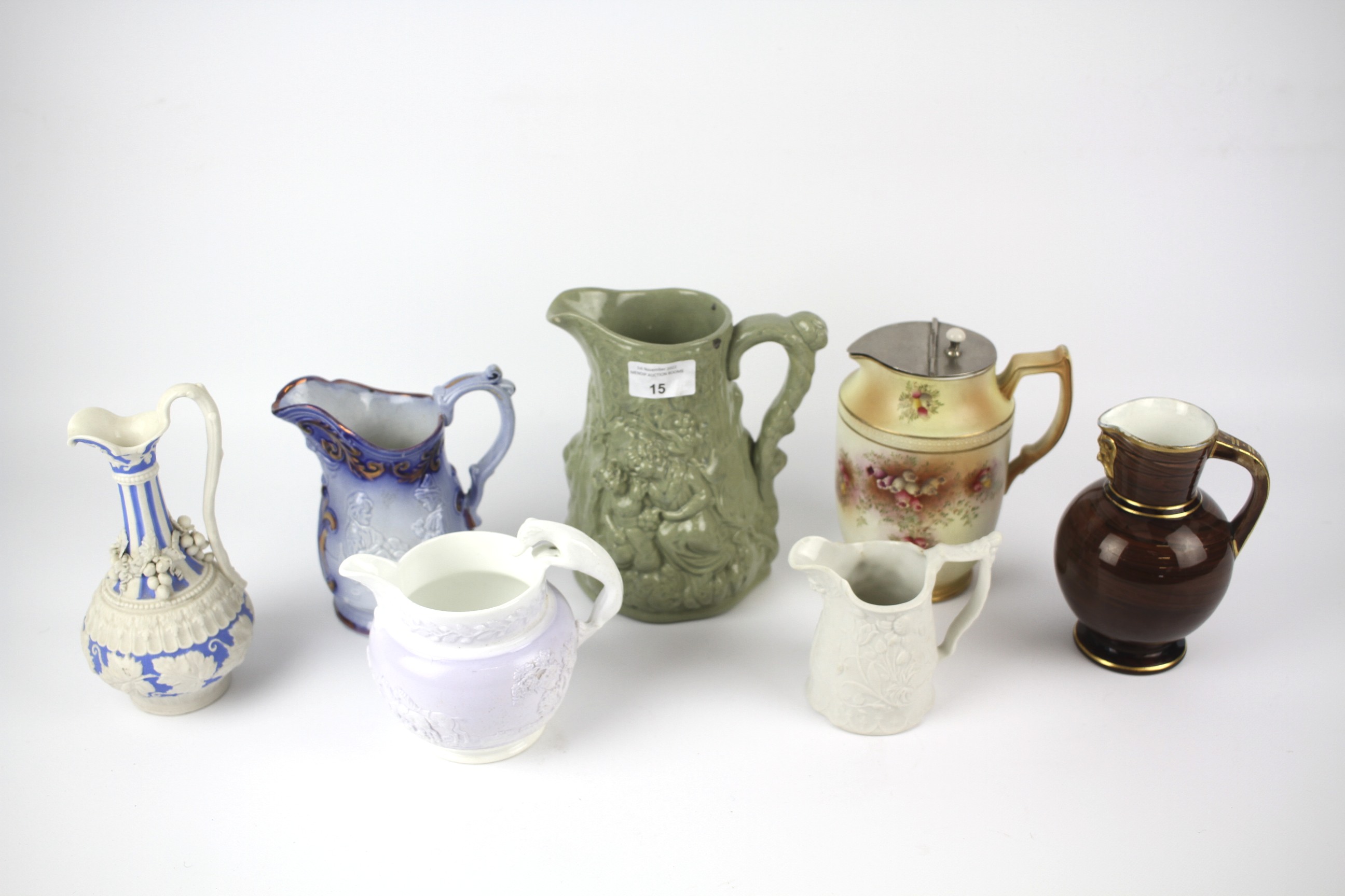 Seven ceramic jugs.