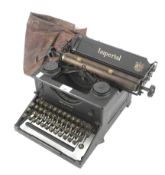 A WWII Imperial 'War Finish' typewriter with outer cover.