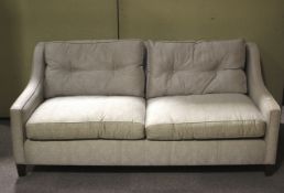 A contemporary two seater sofa.