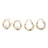 Two pairs of yellow metal hoop earrings. Marked '375', weight 2.