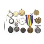 WWI medals, silver coins and pocket watches.