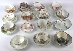 An assortment of 19th century English pottery and porcelain teabowls and saucers.