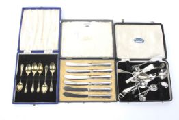 An assortment of silver and white metal flatware.