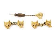 A pair of 9ct gold cufflinks in the form of foxes, together with a matching pin.