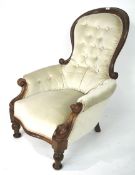 A Victorian button back armchair.