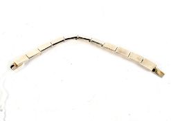 A contemporary white metal articulated bracelet. Stamped 925. 47.