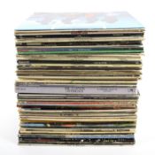 An assortment of 1970s and 1980s rock LPs.
