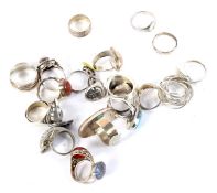 Collection of silver and white metal rings.