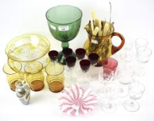 An assortment of glassware and silver plated flatware.
