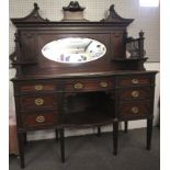 A contemporary mahogany sideboard.