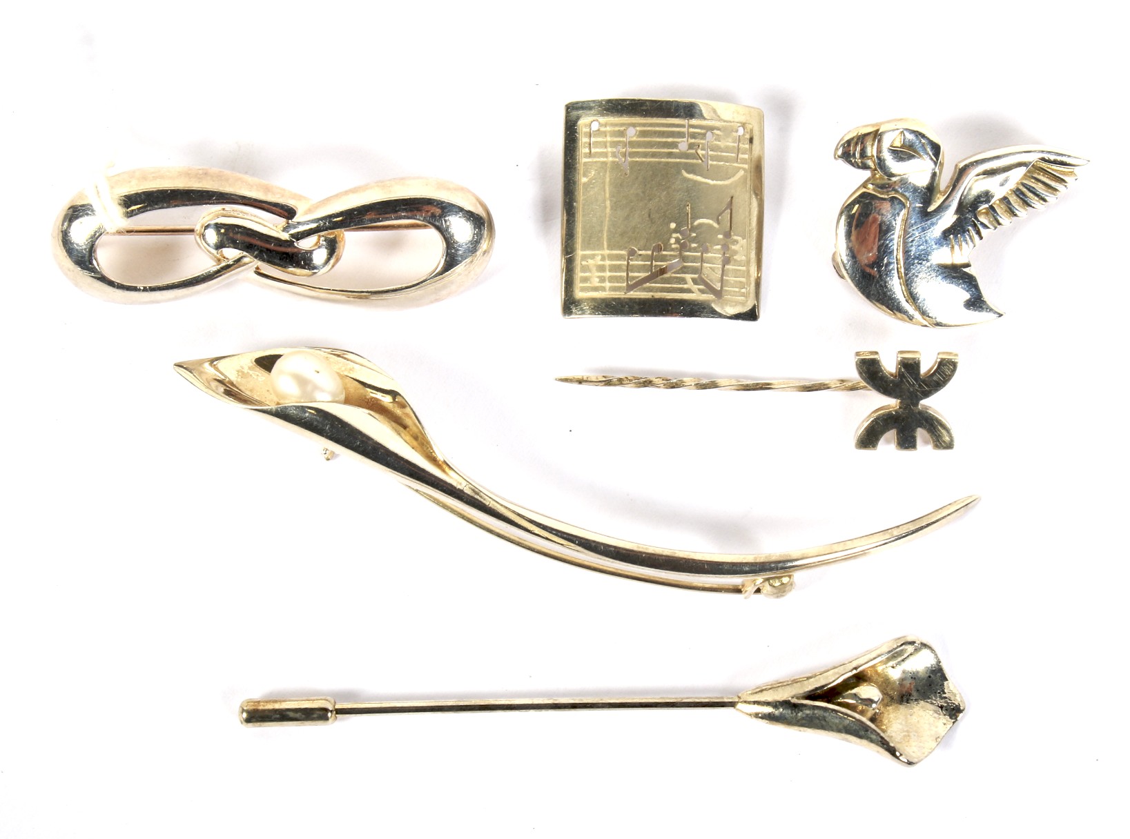 Six contemporary silver brooches. Including a Coco Chanel pin, 23.