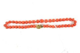 A coral bead necklace.