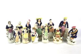 A collection of Staffordshire figures.