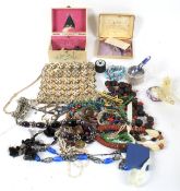 An assortment of costume jewellery and other items.