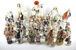 A large quantity of 19th and 20th century Staffordshire figures.