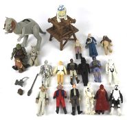 A collection of 1970s and 1980s Starwars toys.