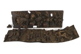 Two 20th century carved wooden panels.