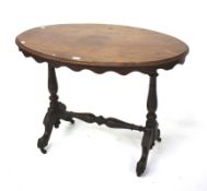 A Victorian walnut centre table.