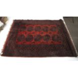 A 20th century large red rug.