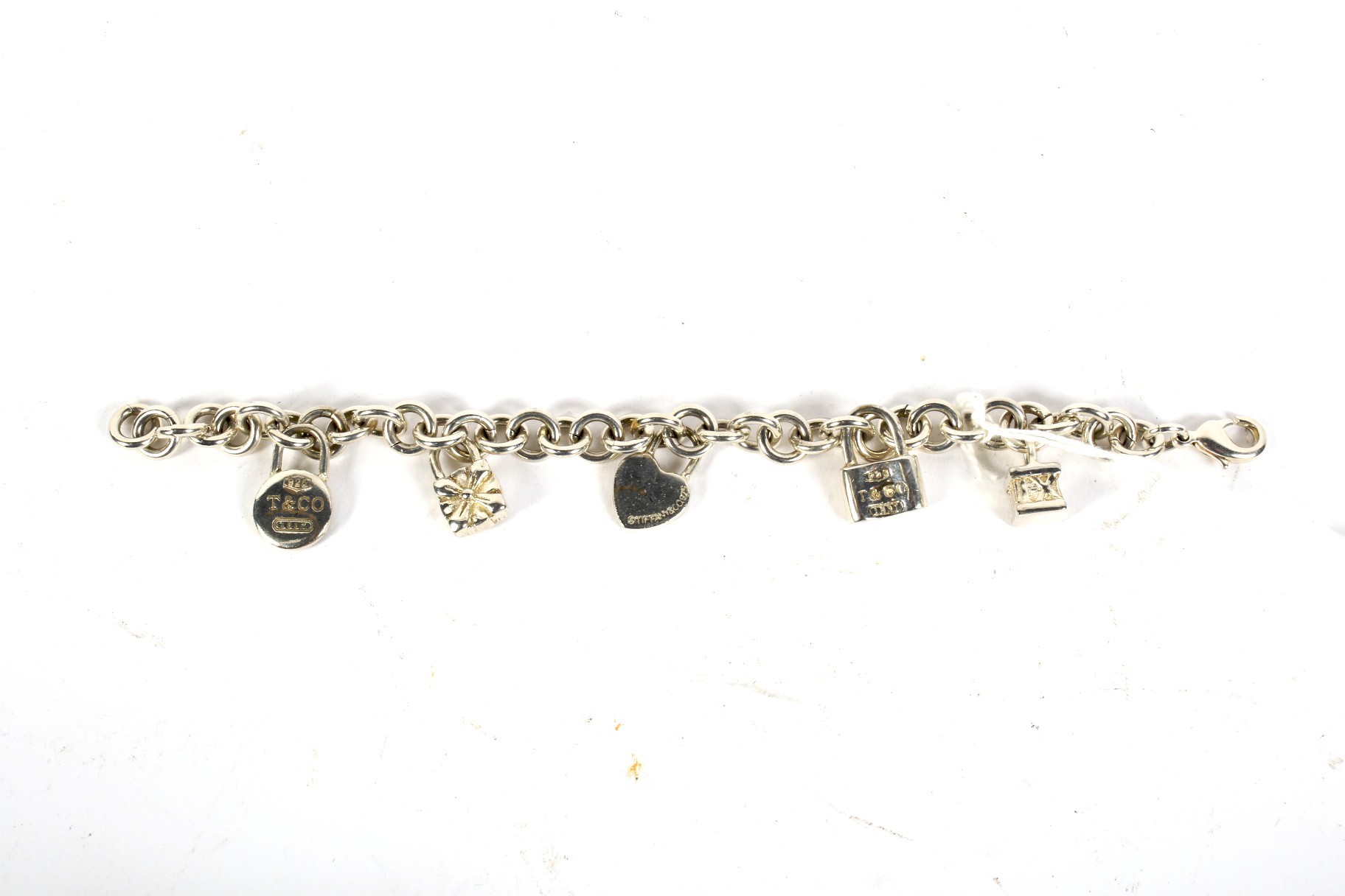 A white metal Tiffany charm bracelet.