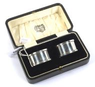 A boxed pair of George VI silver napkin rings.