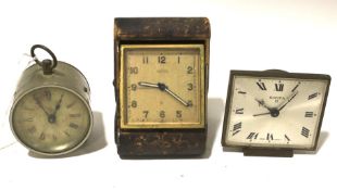 Three antique travelling clocks.