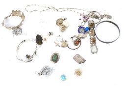 Collection of silver and white metal jewellery. Including bangles, rings, necklaces, pendants, etc.