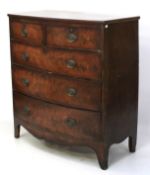 A Victorian flamed mahogany bow front chest of drawers.
