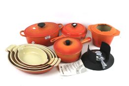 A collection of Le Creuset pots and pans.