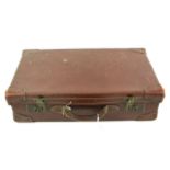 A 20th century brown suitcase.