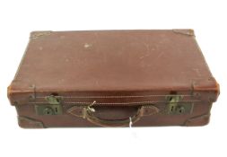 A 20th century brown suitcase.