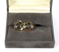 A pair of Christian Dior compass cufflinks.