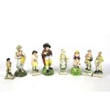 Eight 19th century English pearlware pottery figures.