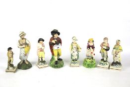 Eight 19th century English pearlware pottery figures.