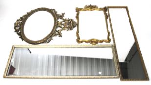 A collection of four gilt framed wall mirrors.