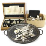 A quantity of silver plated flatware and a twin handled butlers tray.