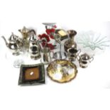 An assortment of silver plated items and assorted ceramics and glass.