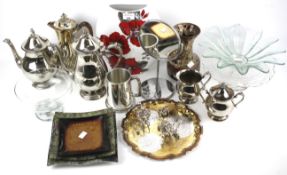 An assortment of silver plated items and assorted ceramics and glass.