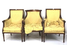 A pair of reproduction armchairs and another similar.