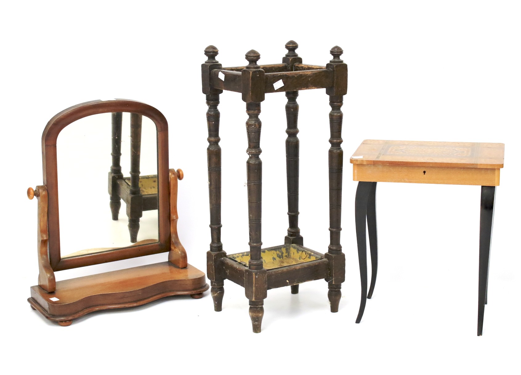 An umbrella stand, mirror and sewing box.