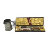 A Victorian horn shafted three piece carving set and a pewter quart tankard.