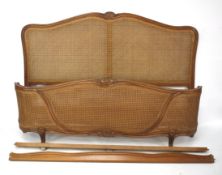 A large 20th century French style rattan bed frame.