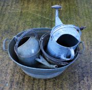 An assortment of galvanised equipment. Including buckets, watering can, etc.