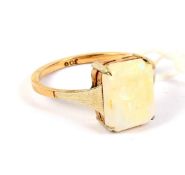 A yellow metal single stone opal ring. Marked '9ct', size M/N, 1.