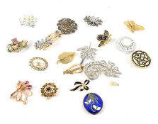 A collection of twenty ladies' costume jewellery brooches. Various designs and sizes.